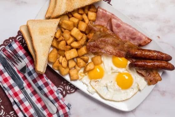 Bacon, 2 Sausages, 3 Eggs, Toast, and Home Fries