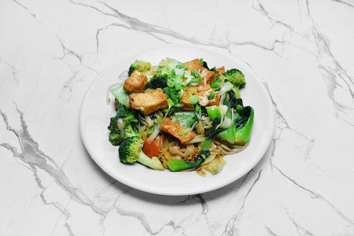 63. Stir-Fried Vegetables and Tofu on Rice Noodles