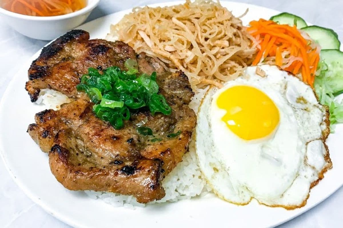 31. Grilled Pork Chop, Shredded Pork Skin, and Fried Egg on Rice / Com Suon Bi Trung