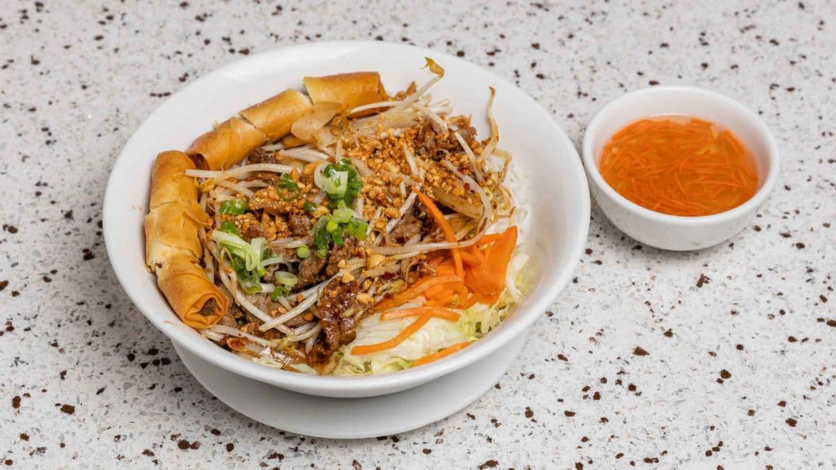 52. Stir Fried Beef & Spring Rolls On Vermicelli