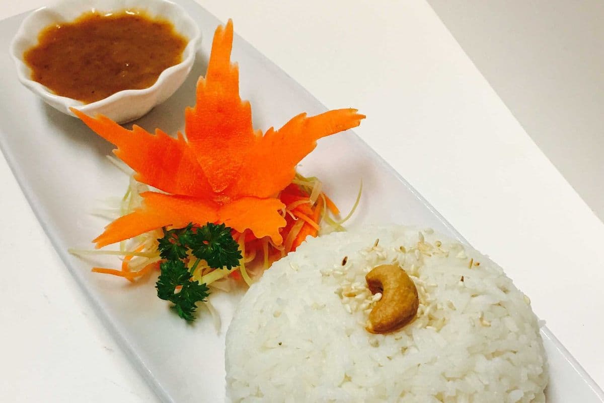 13. Sticky Rice with Coconut Milk and Peanut Sauce