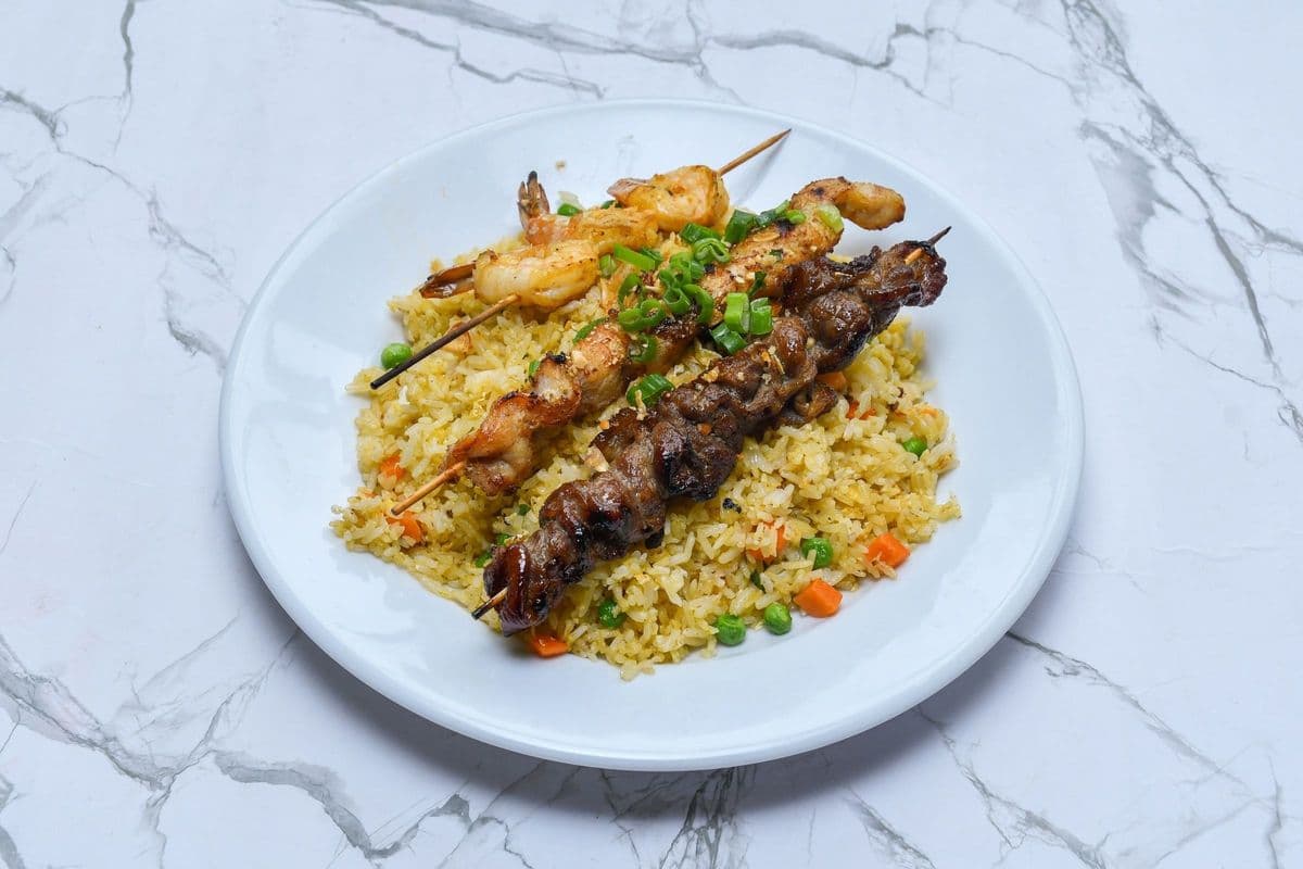 52. Satay Chicken, Beef, and Shrimp Skewers on Fried Rice