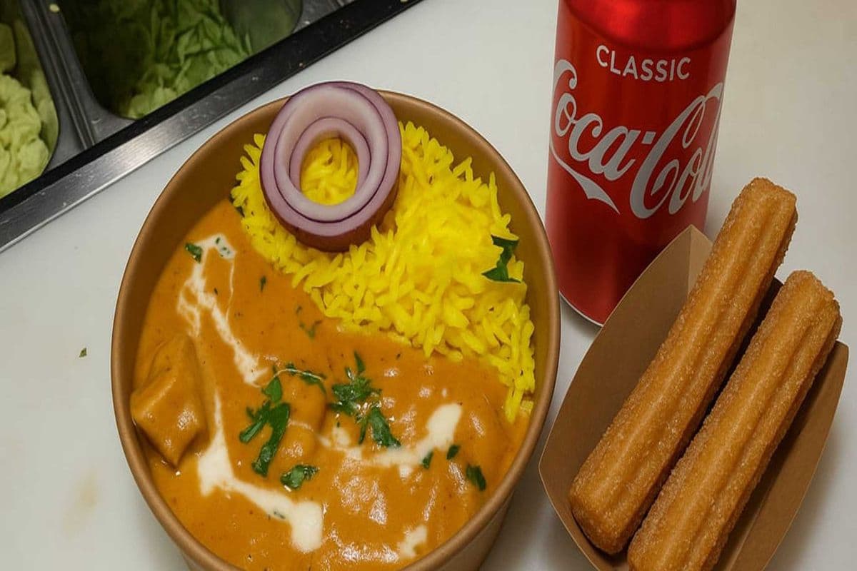 Butter Chicken and Rice meal With Churros and can of pop