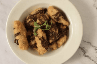 E20 Deep-fried banana with chocolate sauce on top