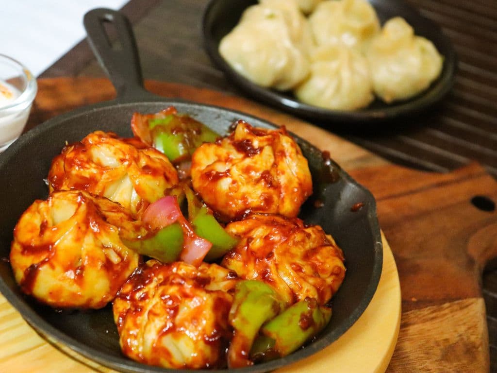 Veg Momo’s ( Chilli Tossed) ( NF)