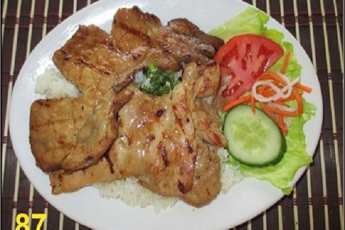 87. steam rice with grilled pork chop and grilled chicken.