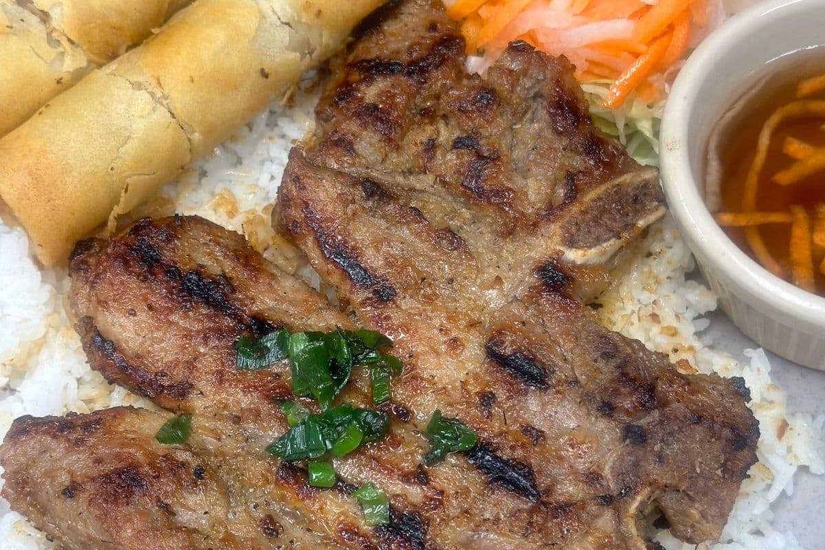 32. Grilled Pork Chop with Spring Rolls on Rice