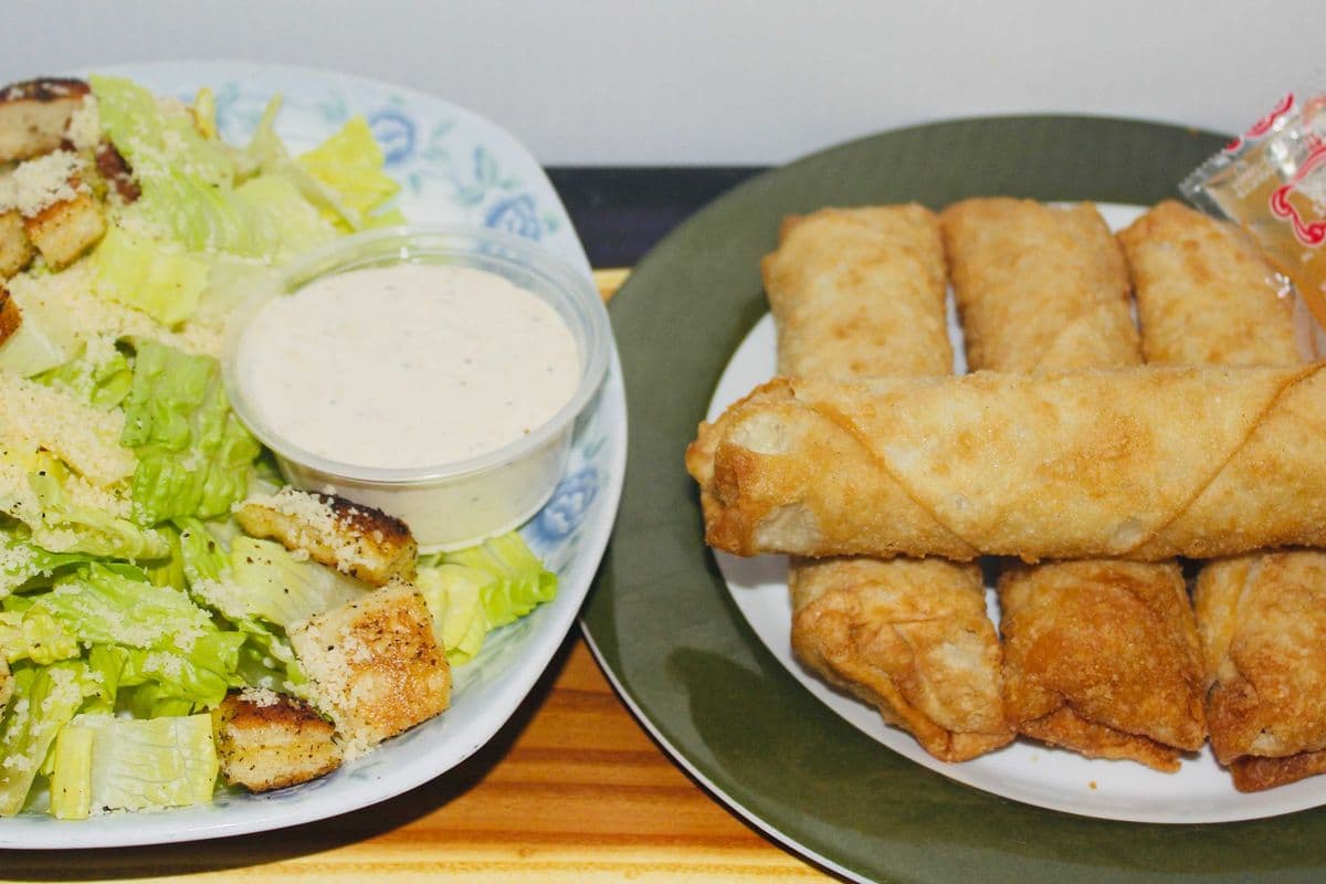 4 Egg rolls and caesar salad