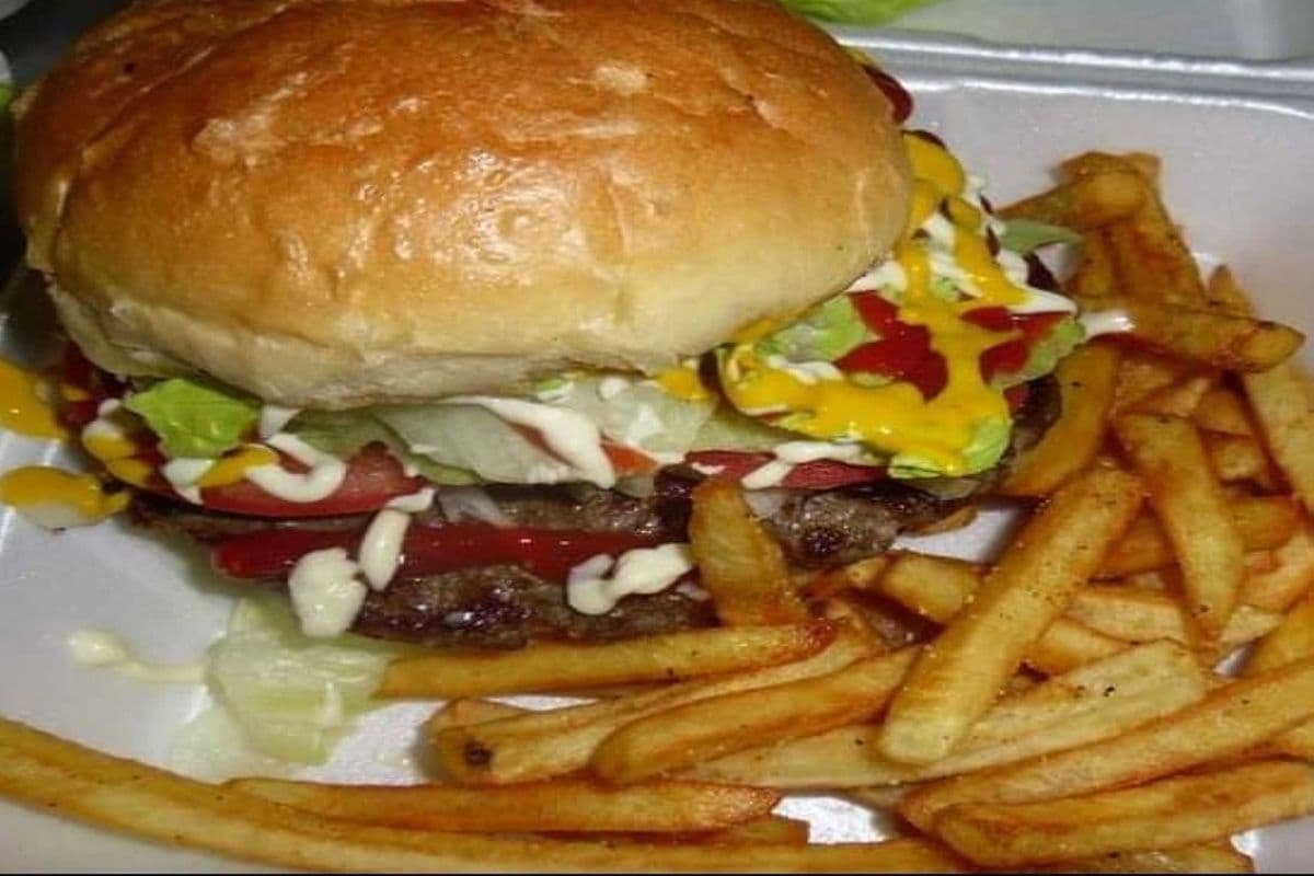 Homemade Beef Burger Served with fries and pop,