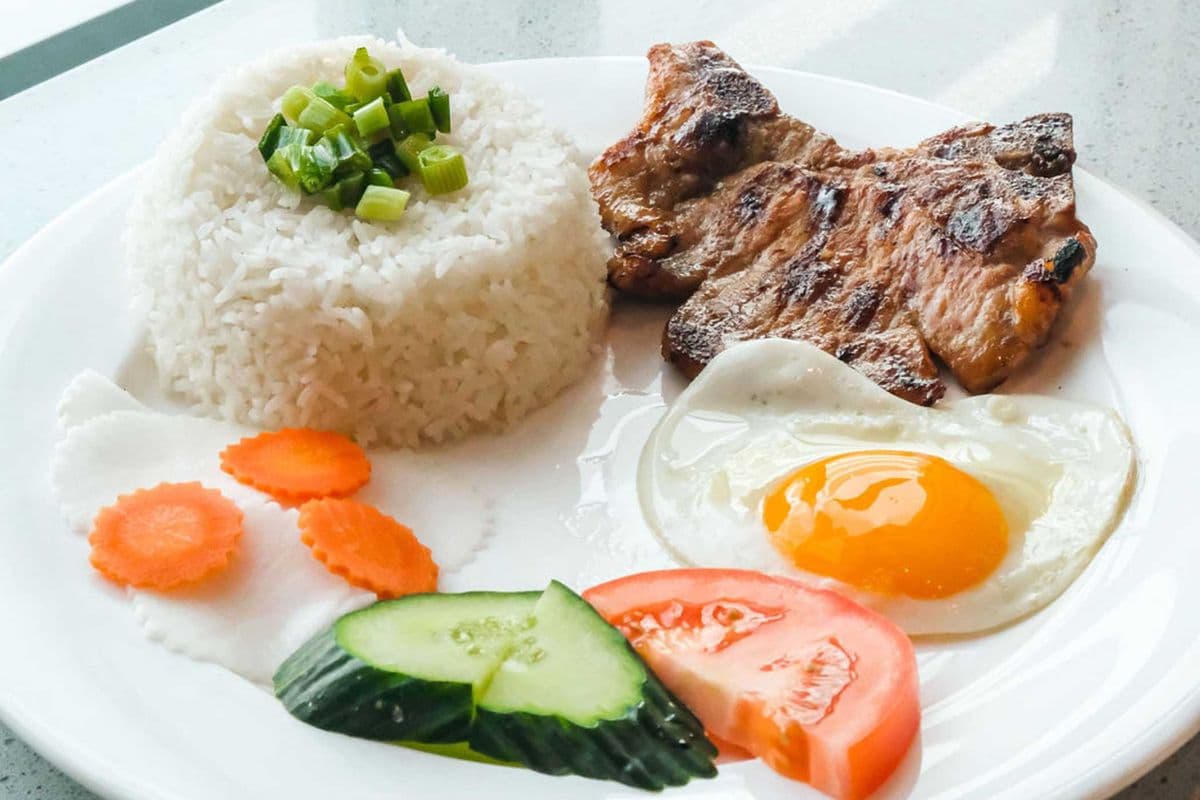 43. Charbroiled Pork Chop and Sunnyside Egg on Steamed Rice