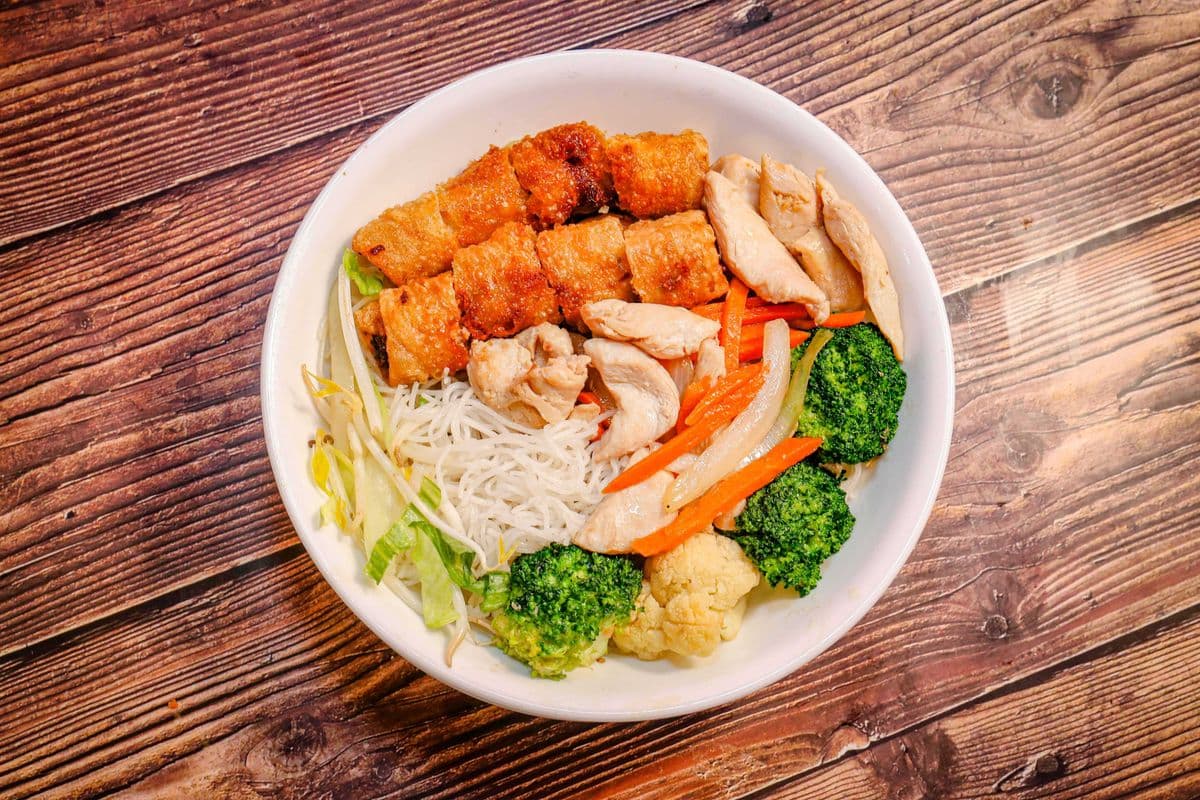 63. Stir-Fried Chicken with Two Spring Rolls on Vermicelli Noodles