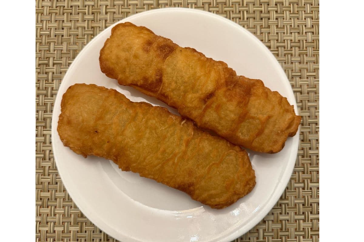 TWO CRISPY FRIED BANANA FRITTERS