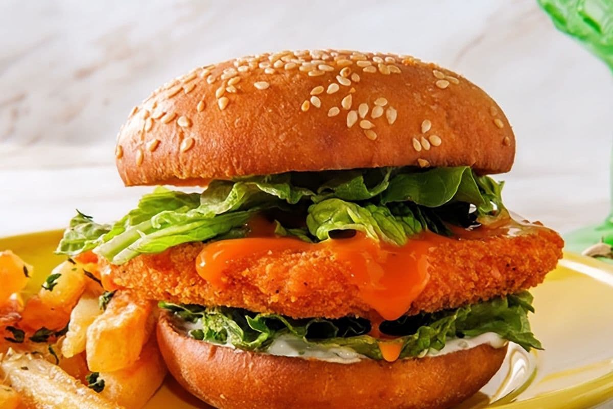 Crispy chicken buffalo bacon cheese burger with fries