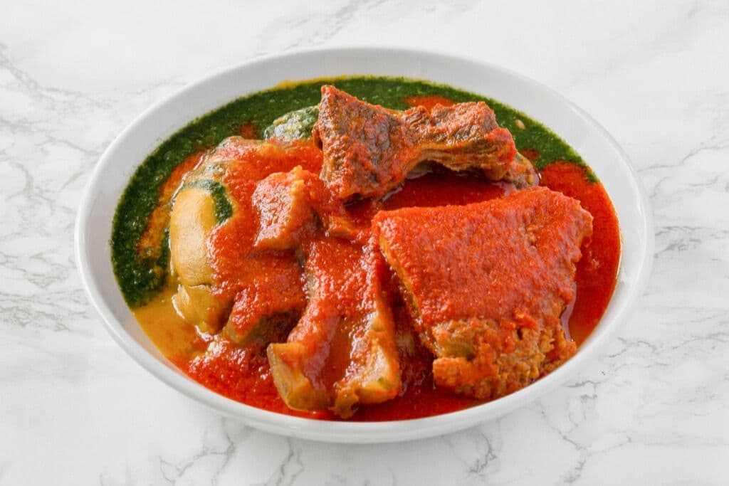 Amala, Gbegiri, Ewedu, Buka Stew, and Three Proteins (All Items in One Plate)