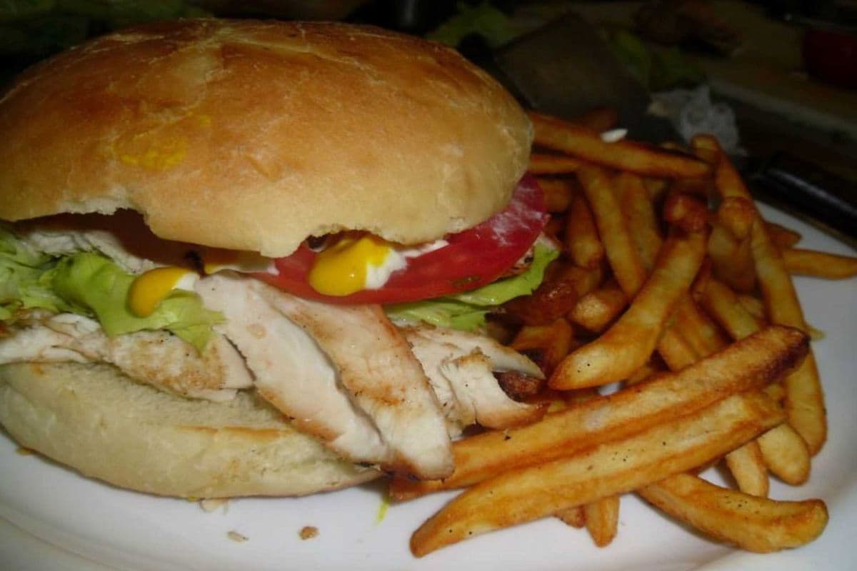 Grilled Chicken on Bun Served with fries and pop,