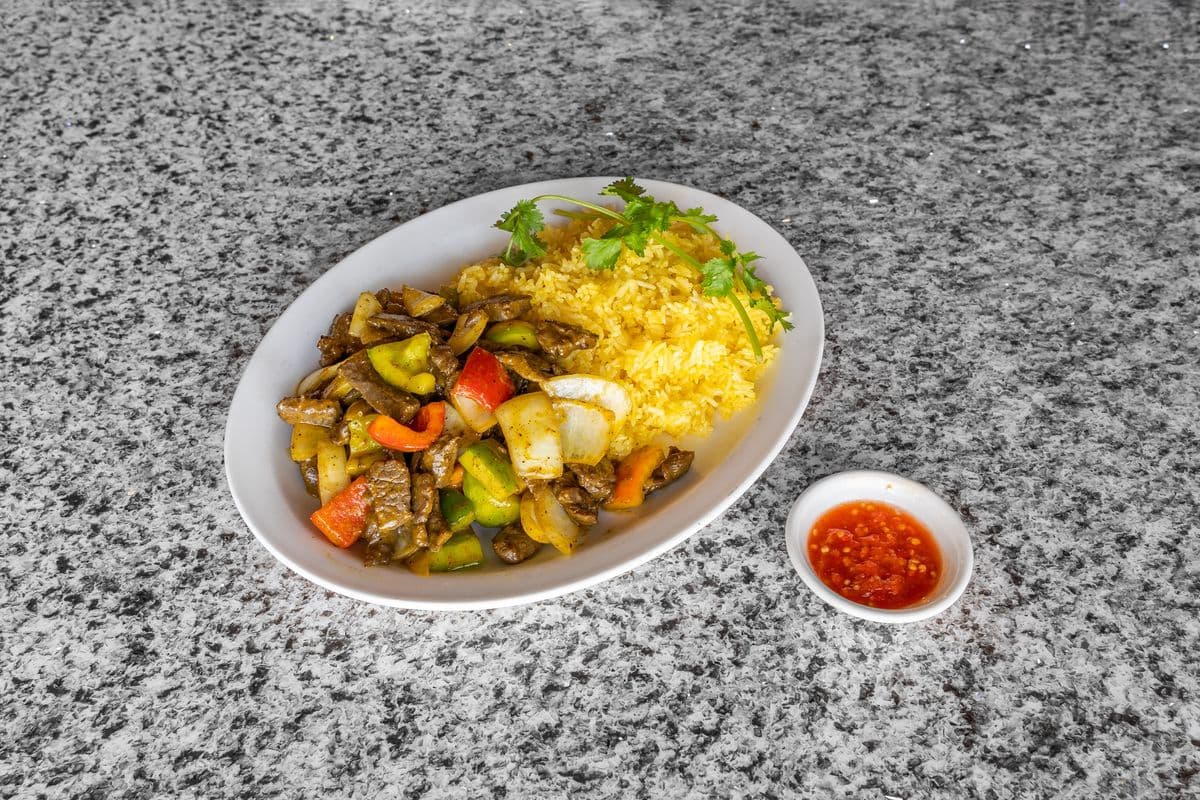110. "Luc Lac" Shaking Beef (8 oz) Wok Fried with Onions, and Peppers on Butter Fried Rice