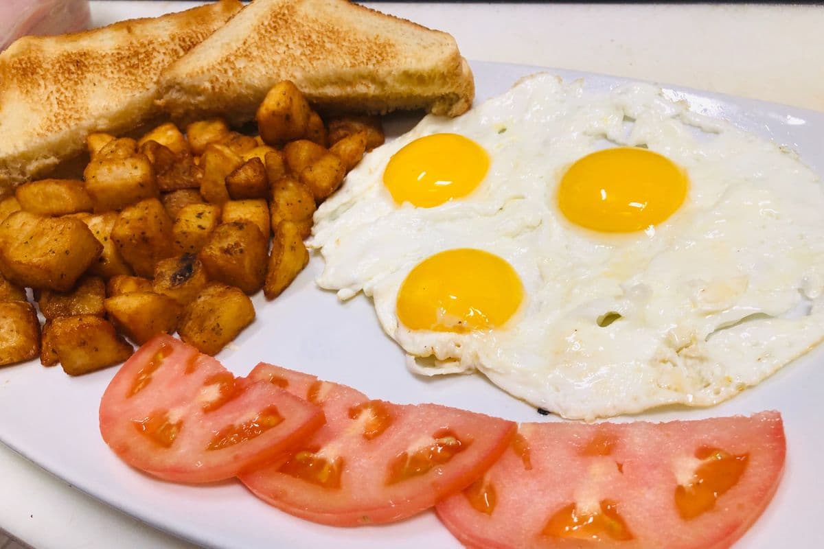 1. Eggs, Tomatoes, Toast, and Home Fries
