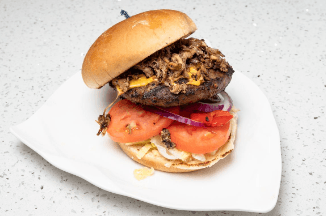 Pulled Jerk Chicken cheese Burger with fries