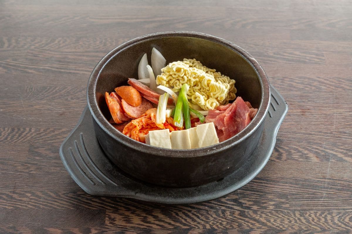 57. Kimchi Stew with Assorted Sausages, Pork, and Tofu