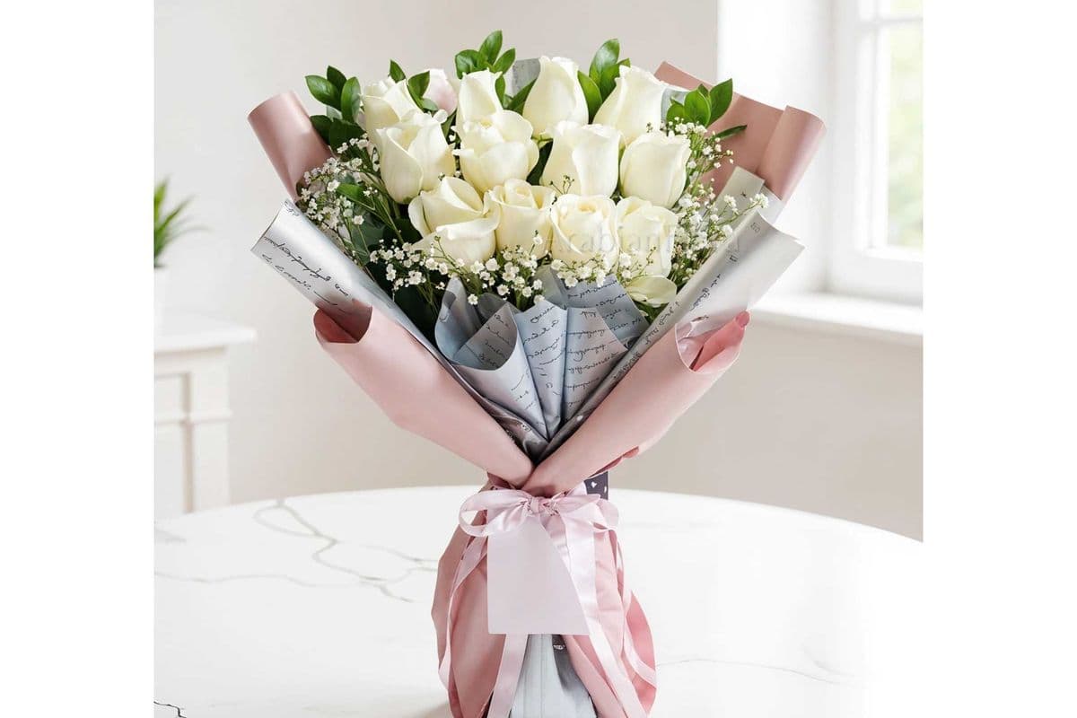 12 White roses wrapped bouquet