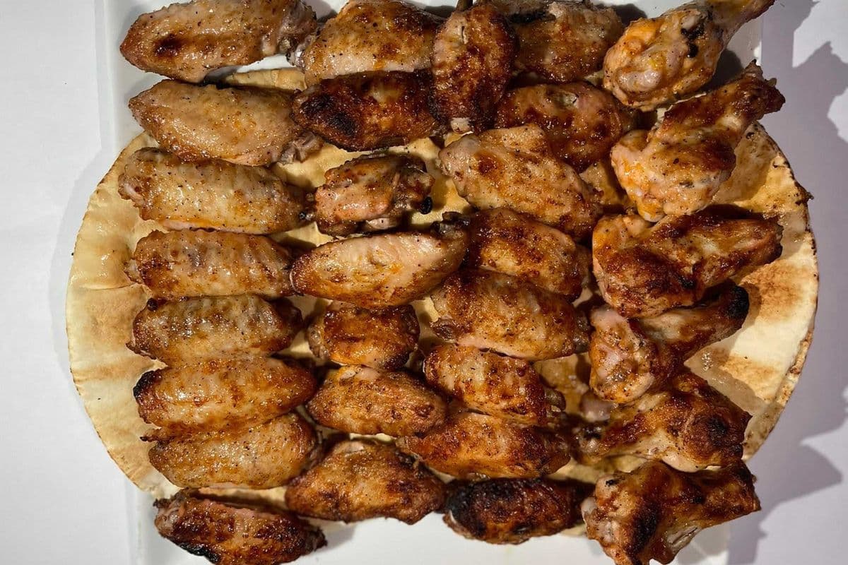 Ailes de poulet (30 mcx) sur charbon de bois