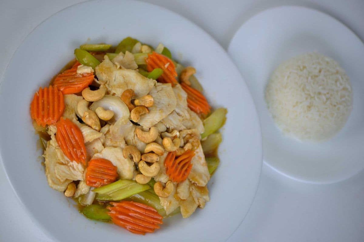 75. Stir-Fried Chicken, Celery, and Cashew Nuts (with Carrots and white Onions) - Ga Xao Rau Cai Hot Dieu