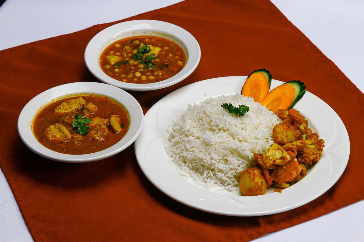 Spicy Chicken, Rice, Pea Curry, and Vegetables