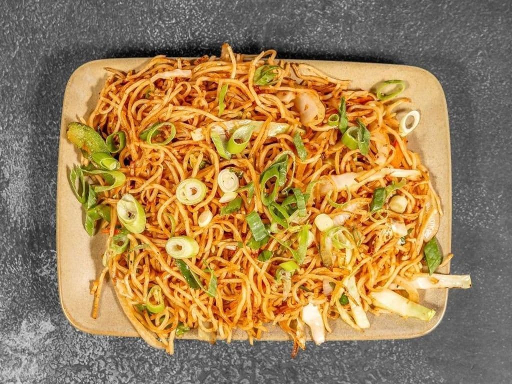 Triple Schezwan Veg Noodles
