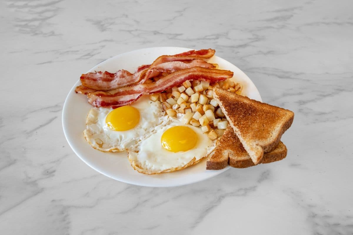 Two Eggs Any Style, Hash Browns and Toast with 3 Meats