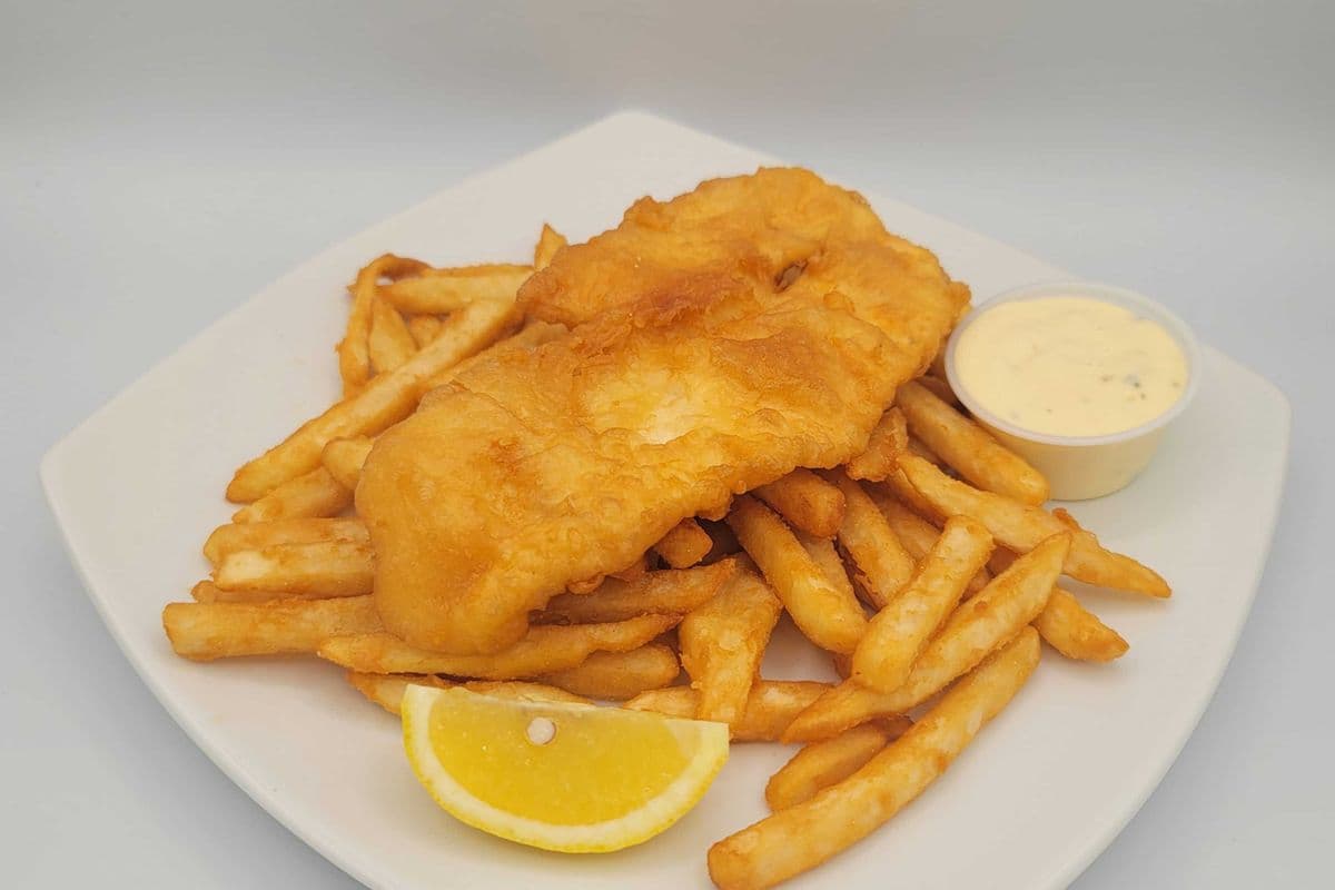 Halibut fish and Chips English style freshly light battered
