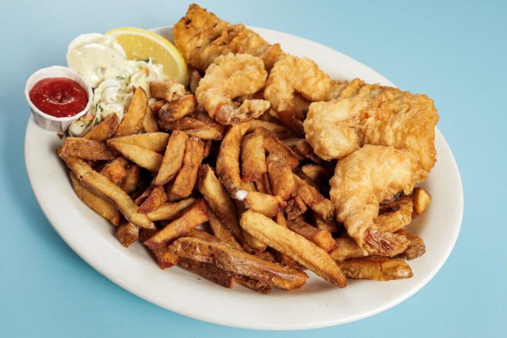 One Piece Cod, Four Hand Battered Shrimp, Chips, and Coleslaw
