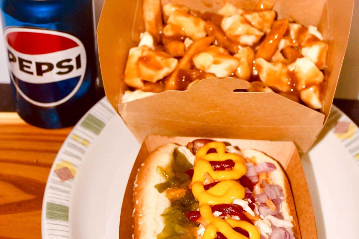 Smoky sausage, Poutine, and a can of pop