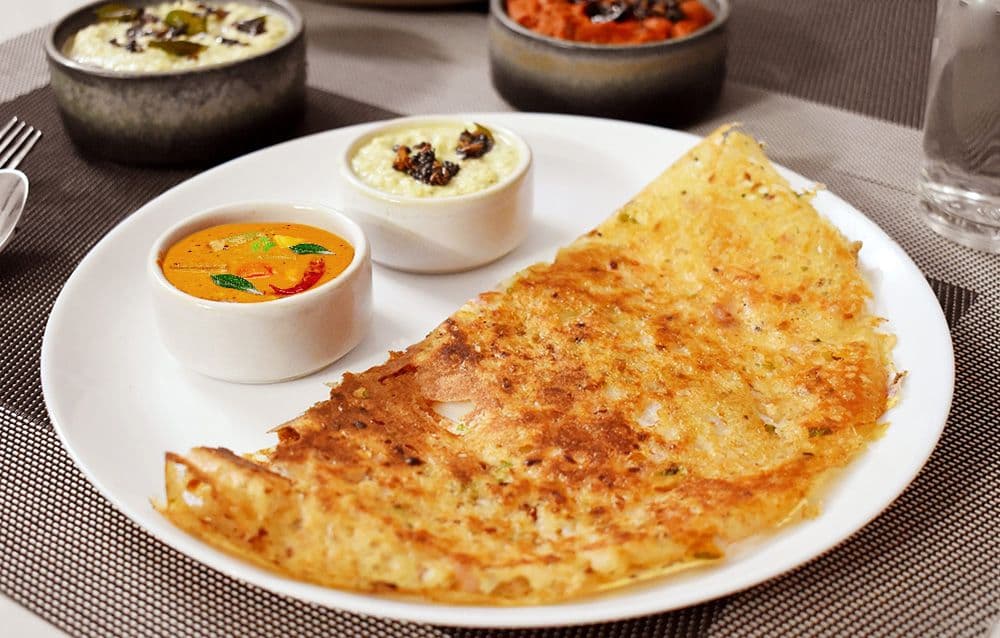 Onion Uttampam with Chutney and Sambar