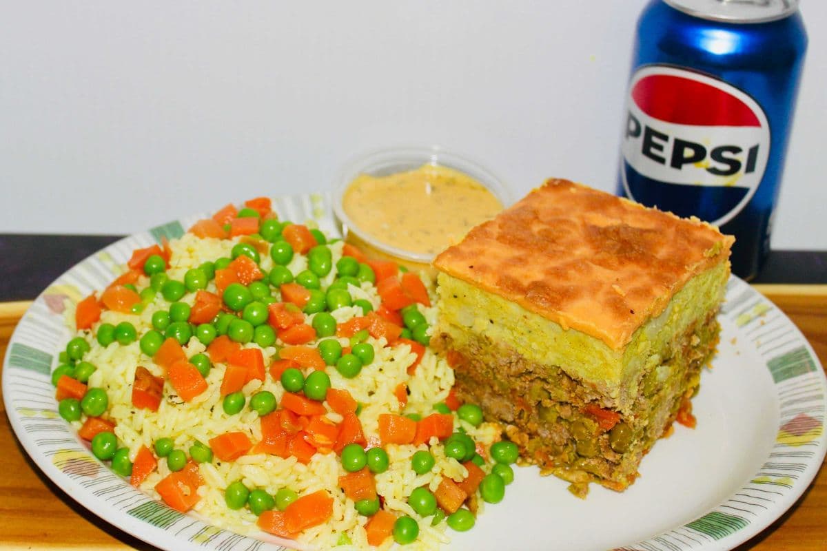 Beef Shepard's pie, fried rice, and a can of pop