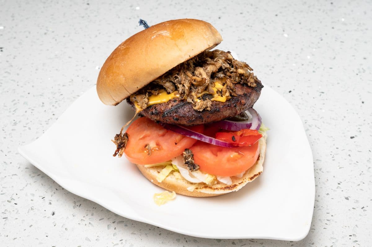 Pulled Jerk Chicken Cheeseburger