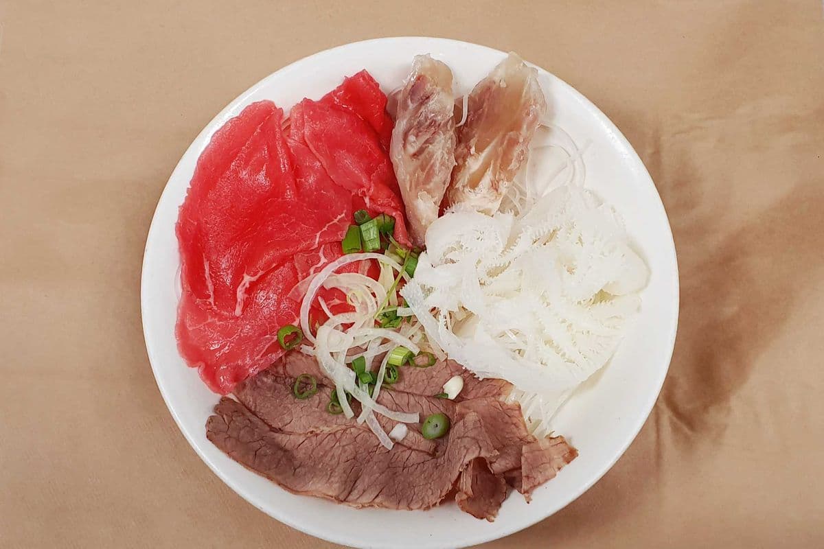 17. Noodle Soup with Rare Steak, Well Done Flank, Soft Tendon, and Beef Tripe- Pho Tai, Nam, Gan, Sach