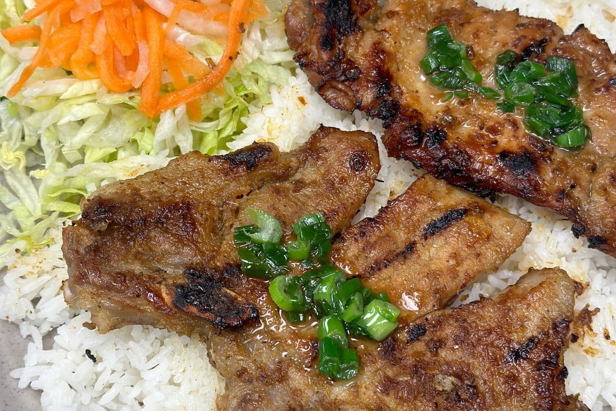 33. Grilled Pork Chop and Chicken on Rice