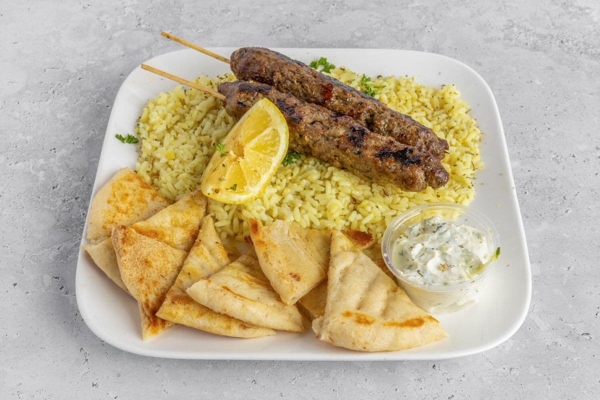 Two Bifteki Served with Rice, Tzatziki, and Pita Bread
