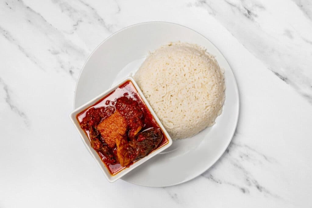 White Rice and Assorted Stew (Diced Shaki, Ponmo, and Beef)
