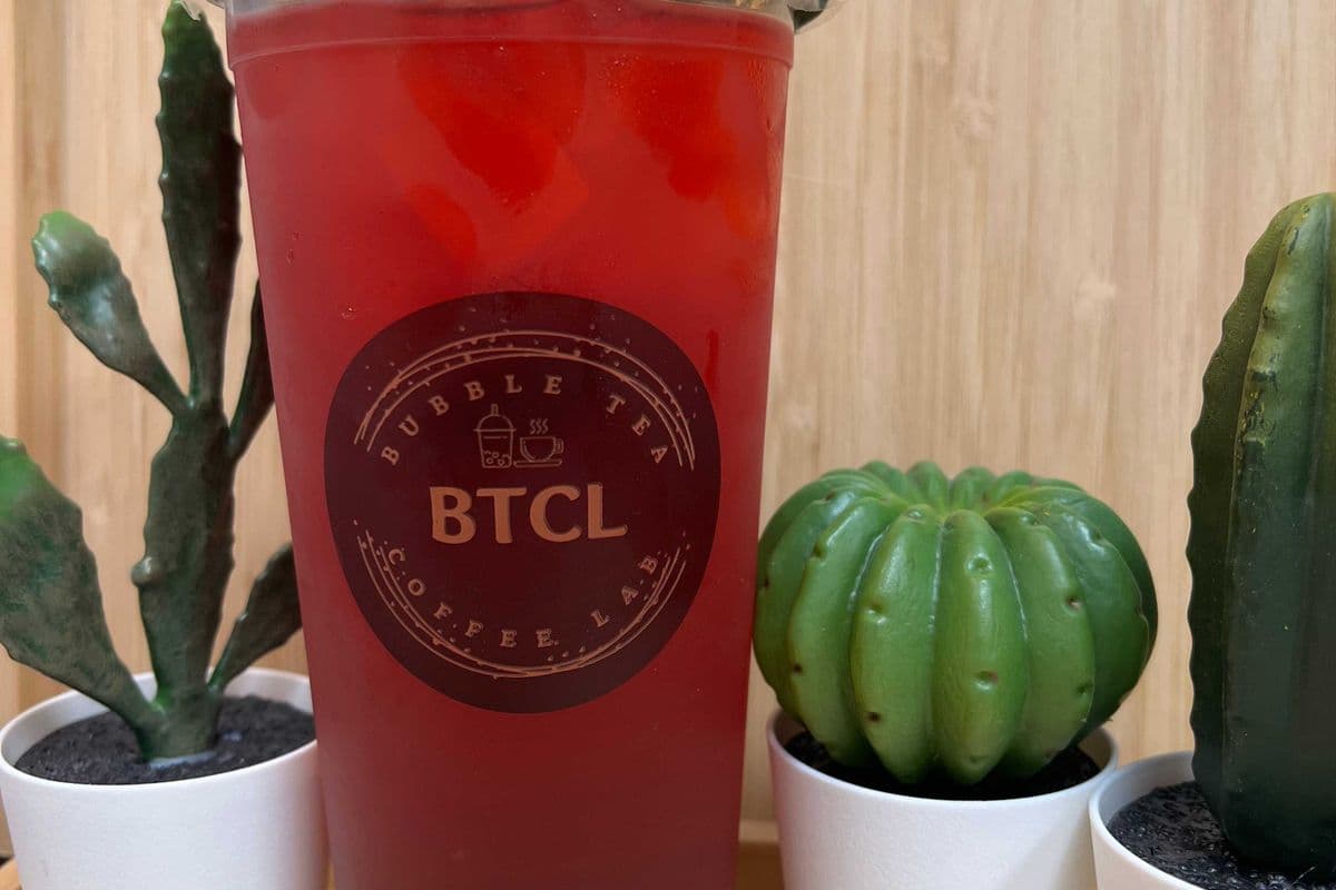 Lychee Pomegranate Ice Shaken Green Tea a with black boba