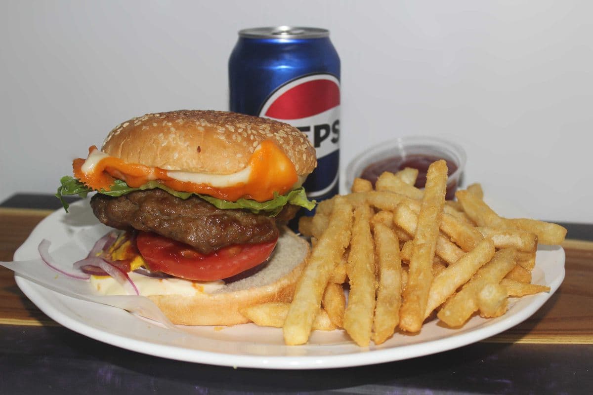 Cheeseburger, Fries, and a can of pop