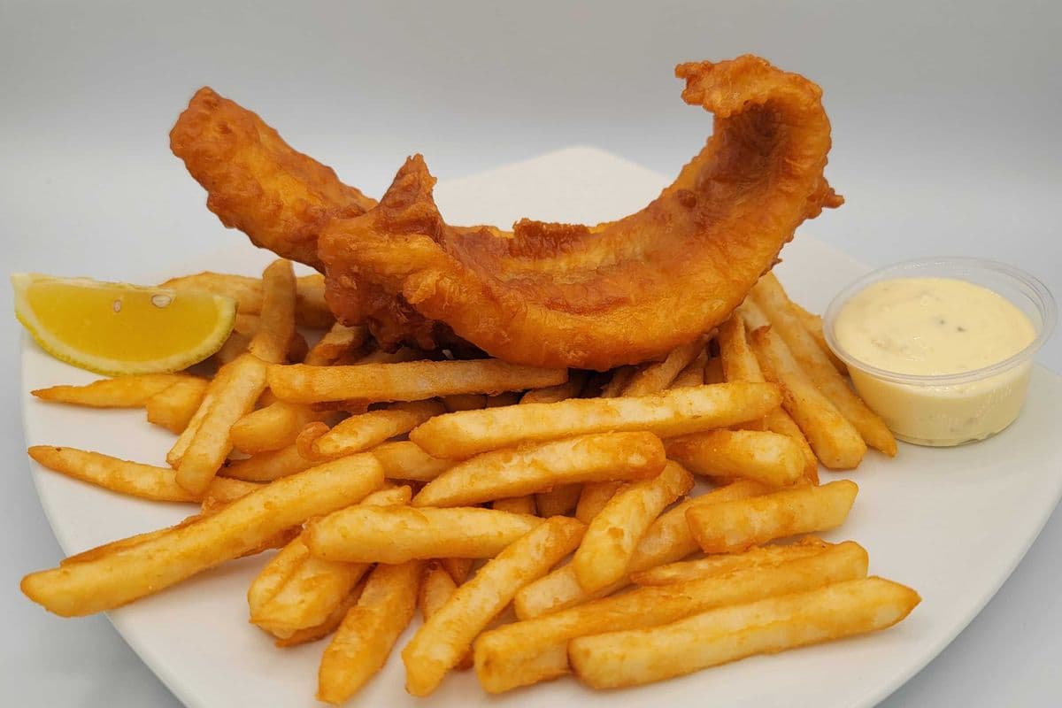 Haddock fish and Chips English style freshly light battered (6 oz)