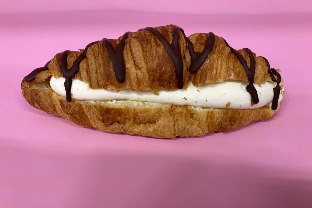 Croissant stuffed with vanilla ice cream & chocolate drizzle