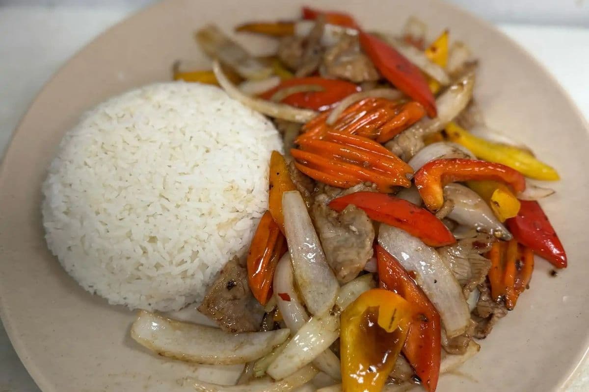 53. Stir-Fried Beef with Onions and Peppers on Steamed Rice