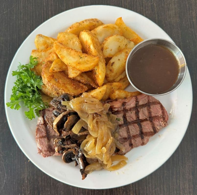 O'Grady's Loaded 8oz NY Striploin Served With fries, Vegetables, Sautéed Onions & Mushrooms
