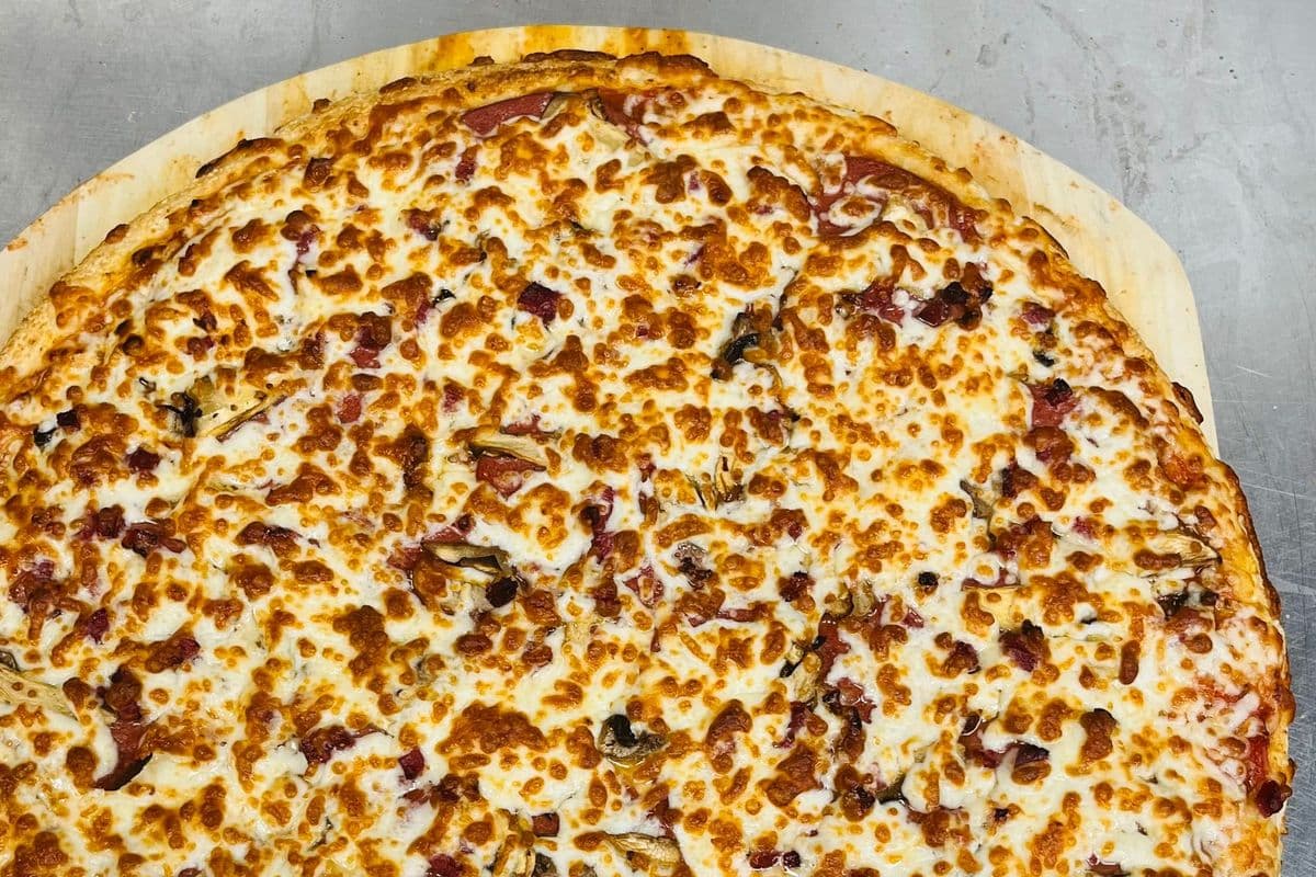 12" Medium Signature Canadian Feast Pizza and Choice of Second Pizza