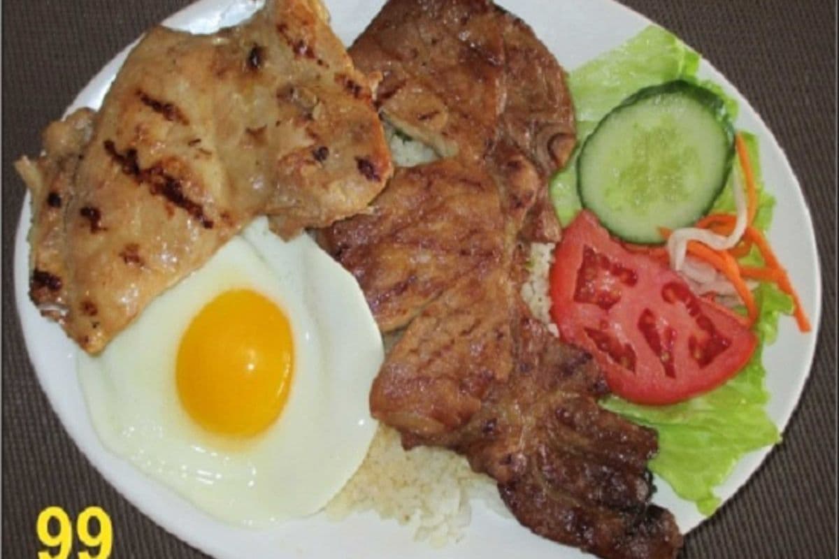 99. Steam rice with grilled pork chop, grilled chicken, and fried egg.