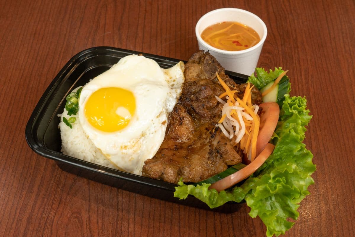 501. Grilled BBQ Chicken, Pork Chop , and Fried Egg on Rice - (Com Suon Ga La)