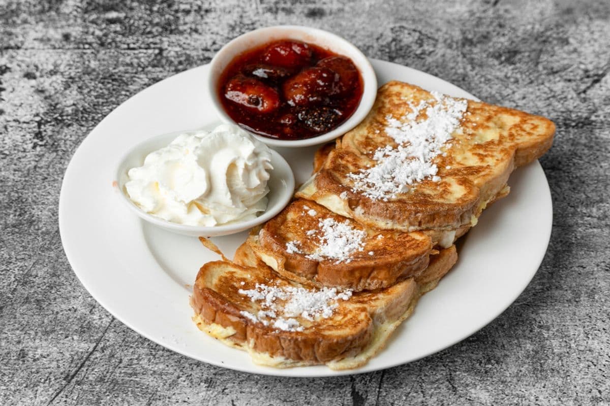 French Toast with Strawberry Compote and Whipped Cream