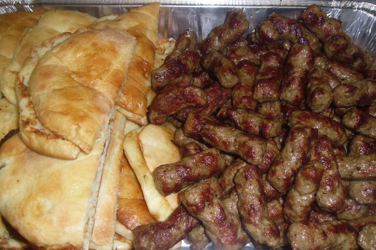 100 pcs.chevaps(kebabs). Just right.Served with 10 pcs. home made stone baked bread,kajmak[home made dip] and fresh choped onion.